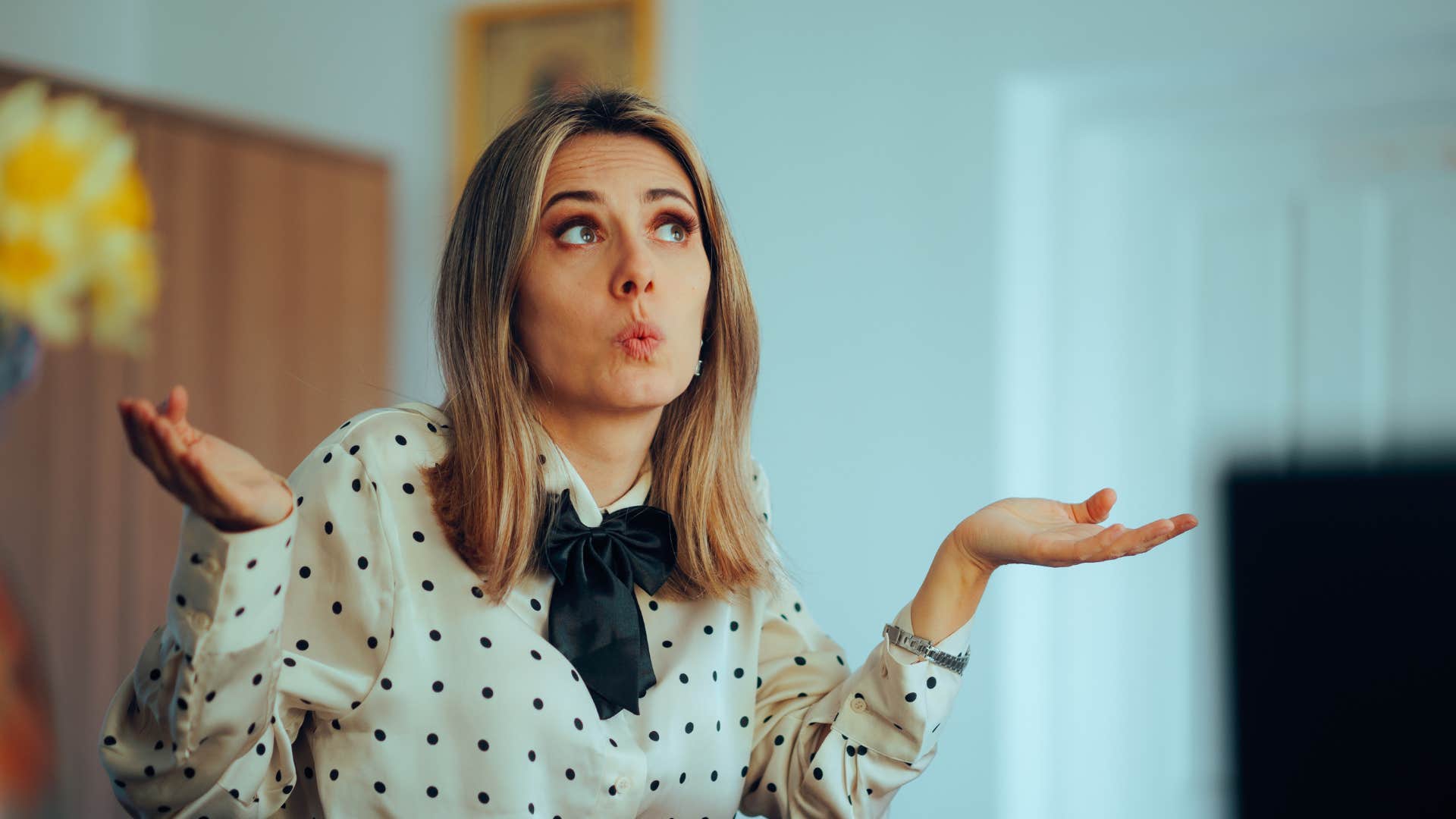 woman shrugging lacking morals