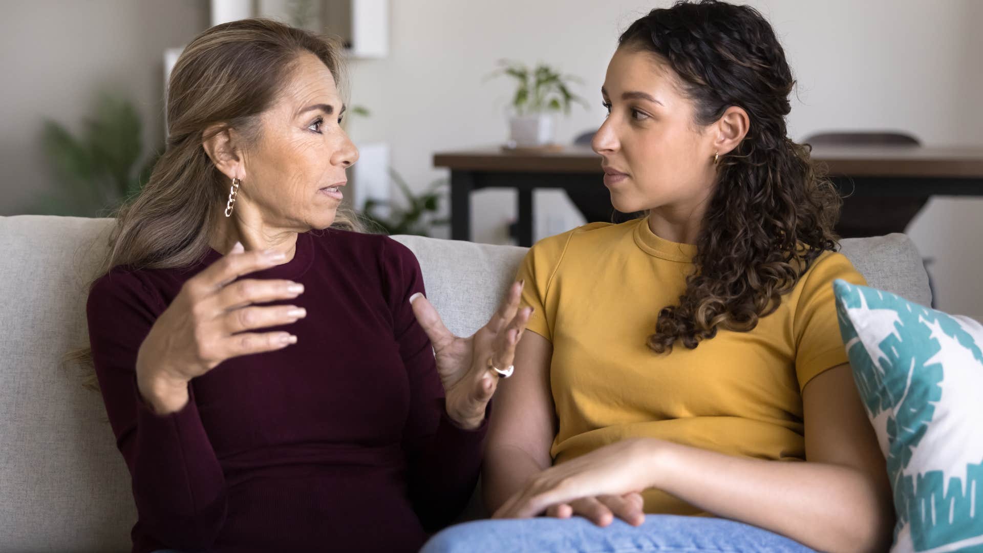 boomer woman talking to daughter with different values and opinions