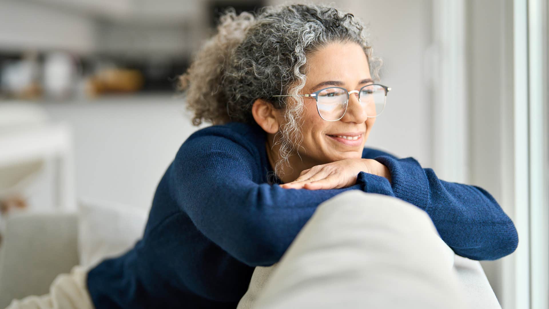 older woman with no fears of boredom relaxing at home