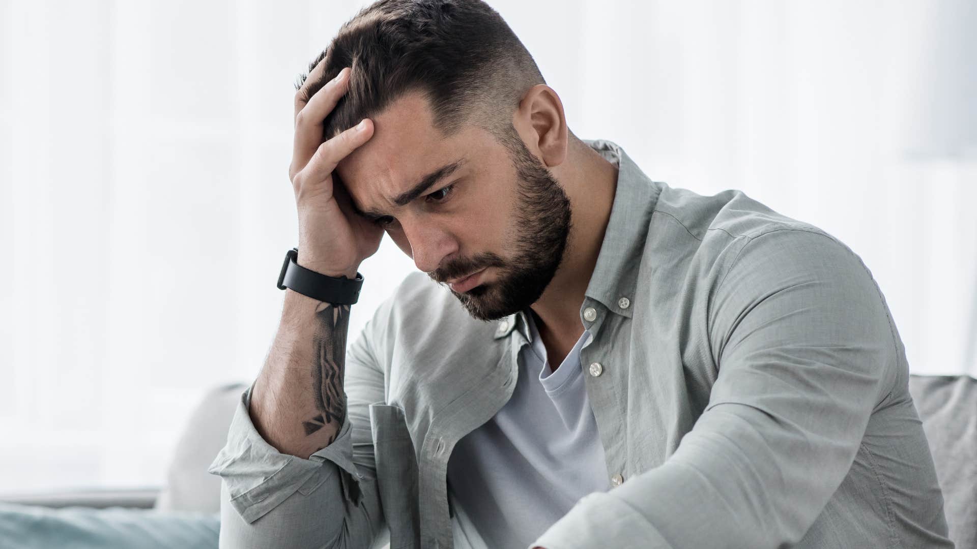 stressed man thinking about the unfairness of life