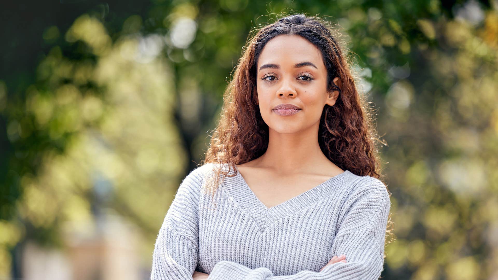 emotionally independent woman standing outside confidently