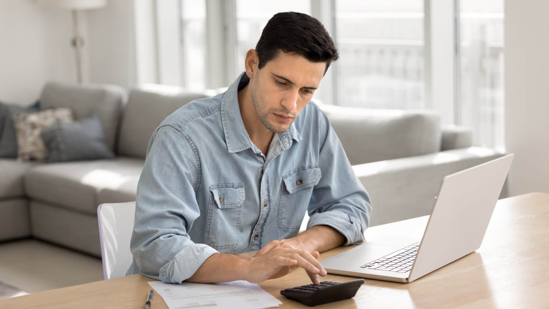 financially strategic man planning his budget