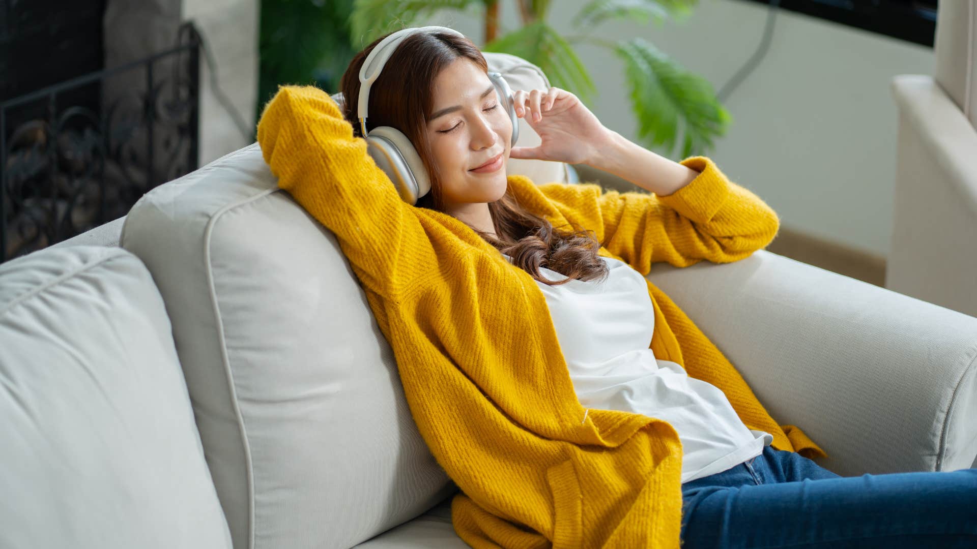 minimalistic woman relaxing listening to music