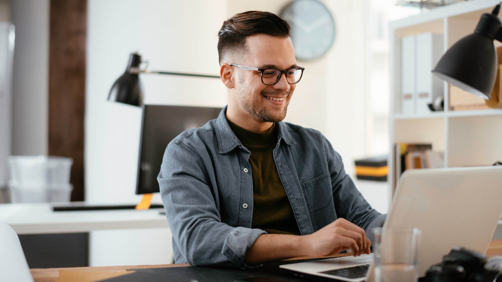 man with perfectionist tendencies working hard on laptop