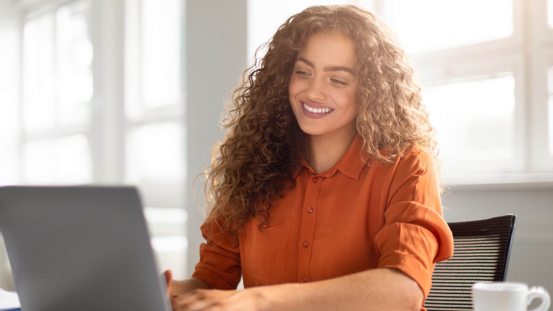 smiling woman without tattoos following the rules at work