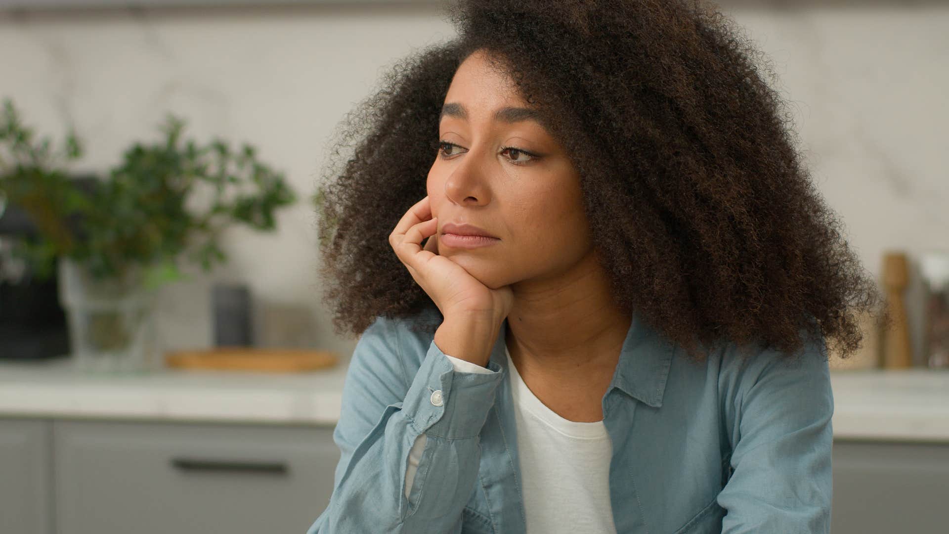 woman ruminating getting wrapped up in big feelings at home alone