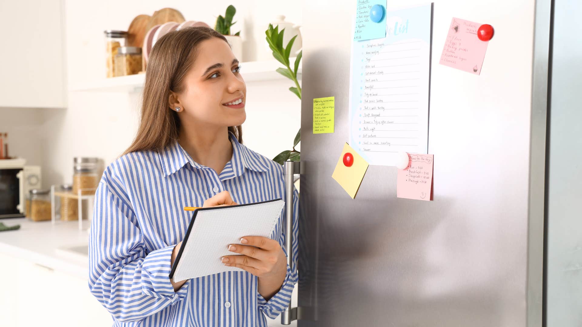 woman looking at meaningless tasks on fridge to check off list
