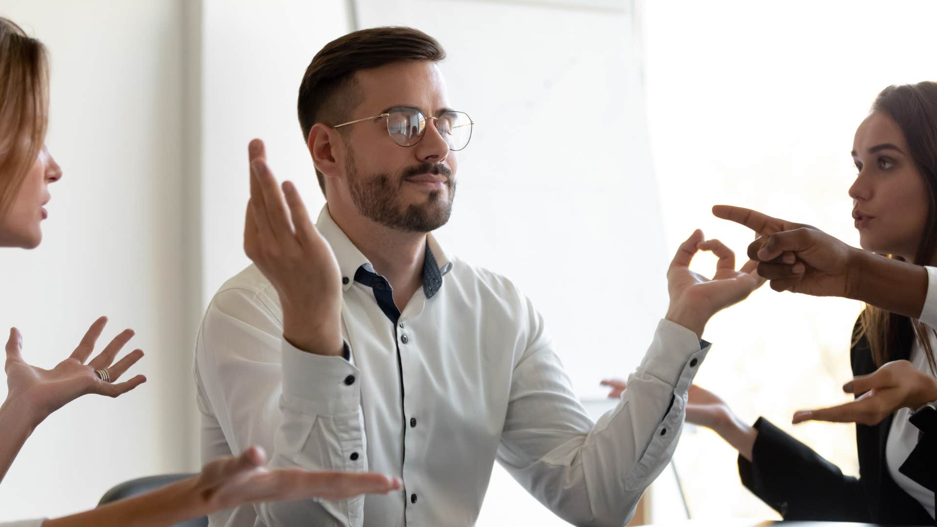 stressed man staying grounded in chaotic environment