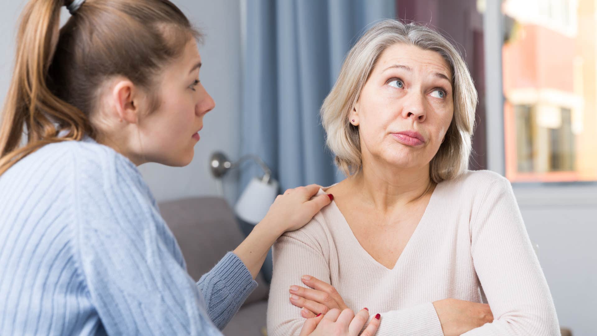 older woman picking up on her daughter's cruelty disguised as humor
