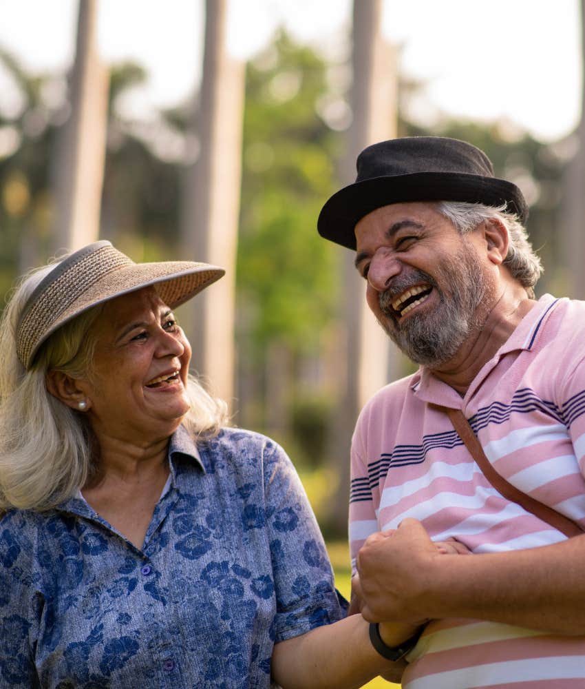 happy older couple walking for exercise