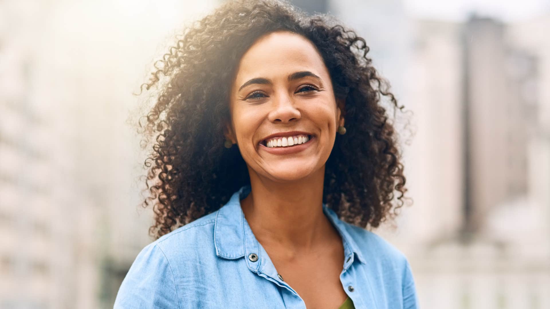 woman who protects their independence smiling outside