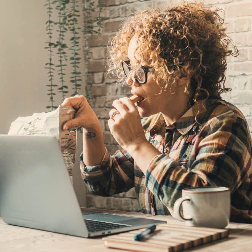 Woman who struggles to slow down snacking at work