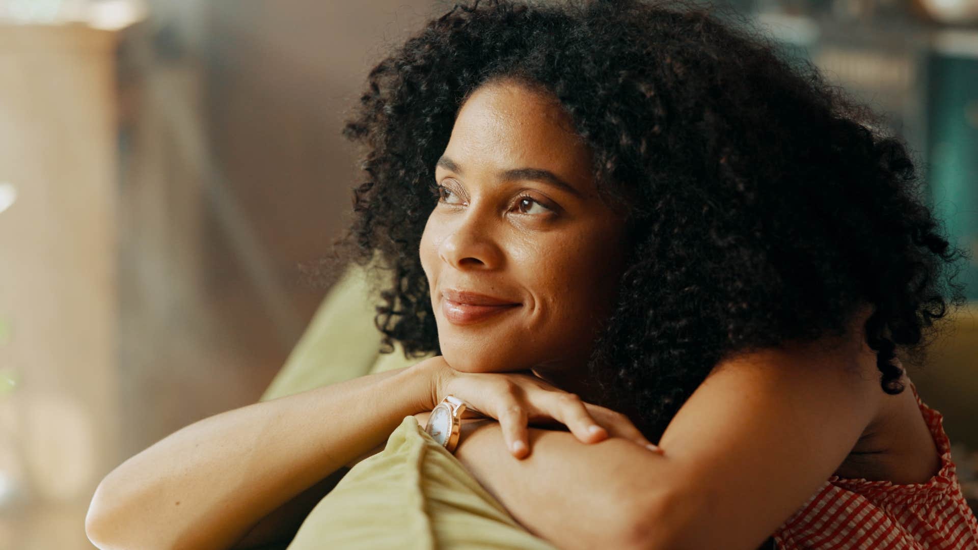 woman who needs solitude to recharge sitting alone at home