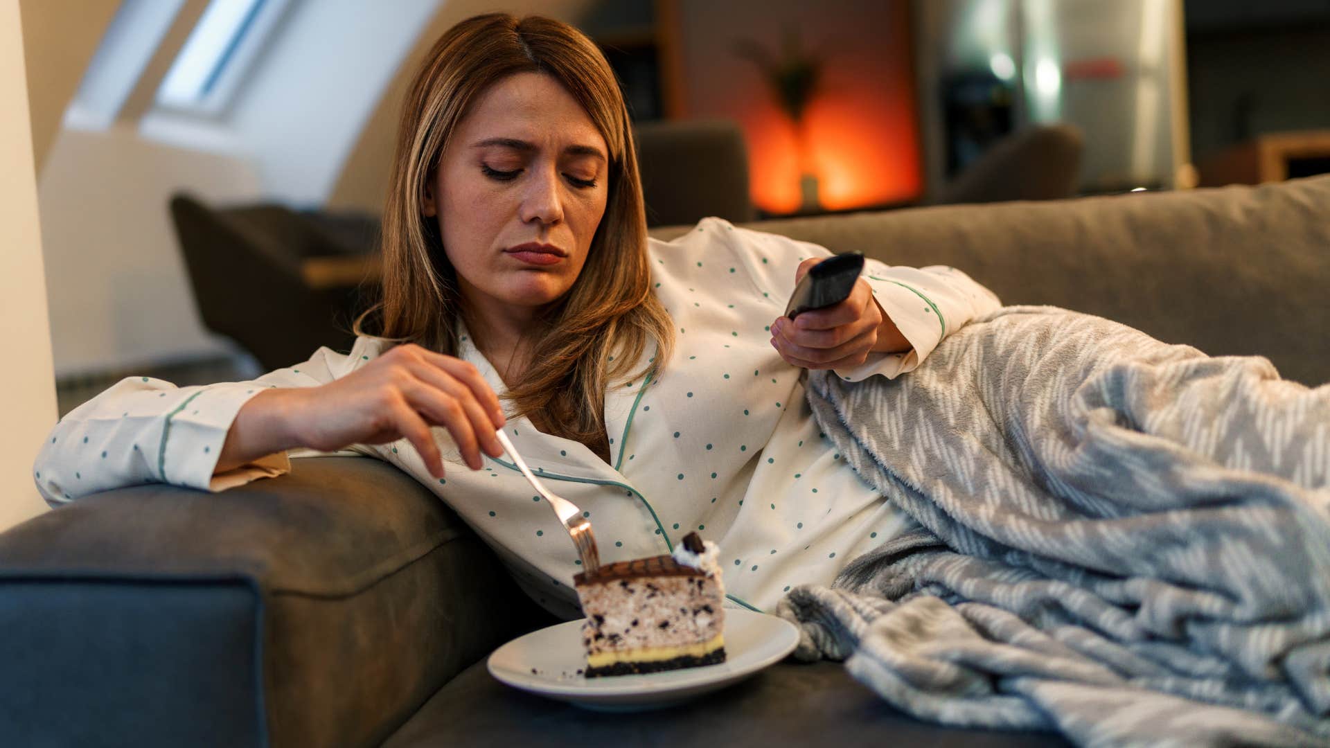 Woman who rewards themselves with food at home.