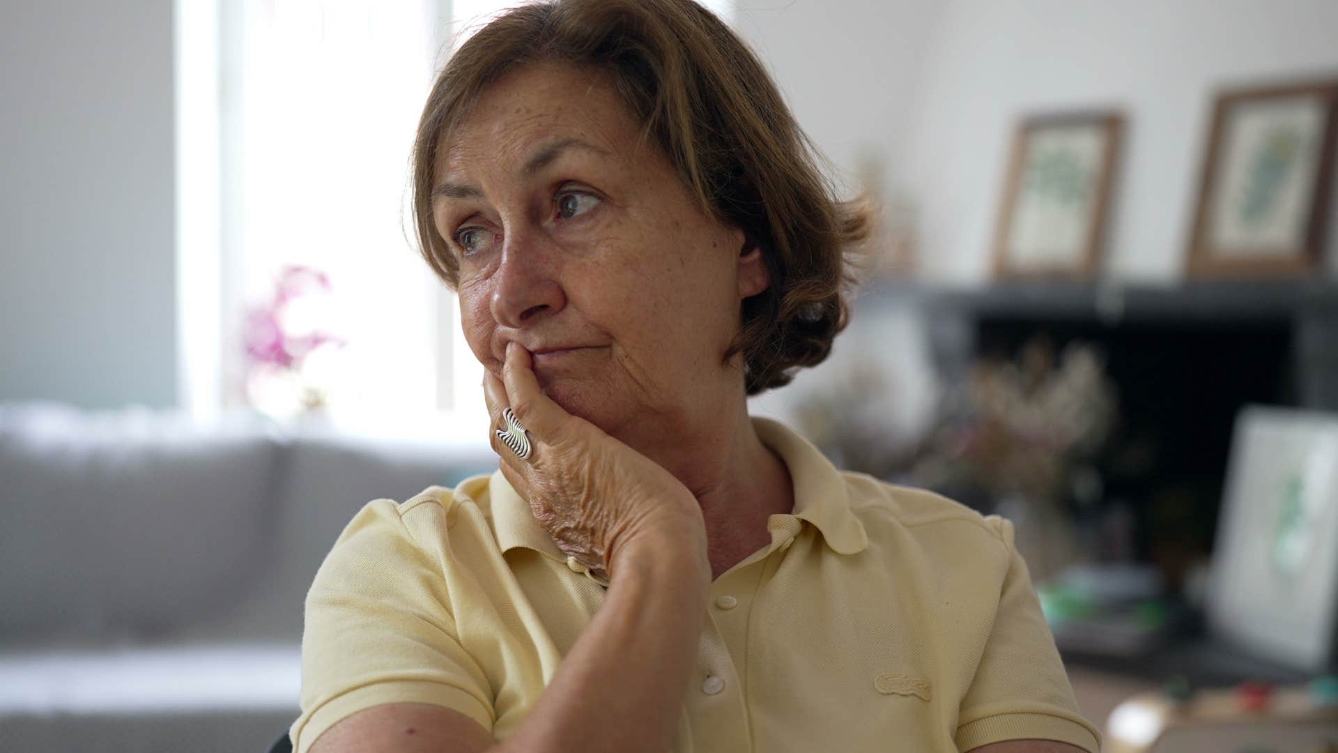 Woman struggling with healthy routines at home.