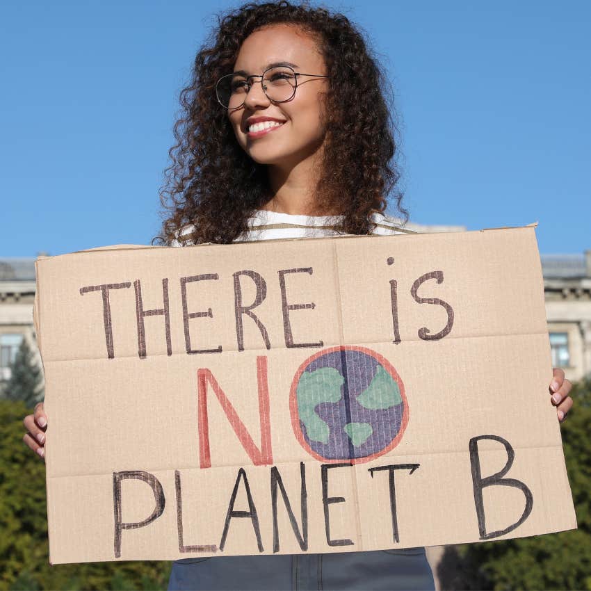 woman who cares deeply about climate change protesting outside