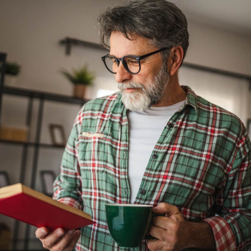 man with strong morals reading a book instead of using ai