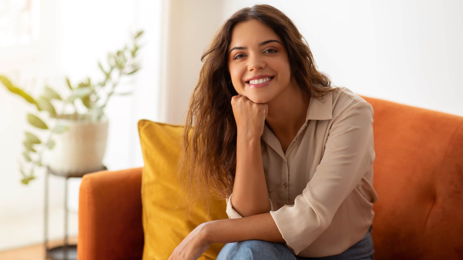 woman at home not afraid to face fomo smiling confidently