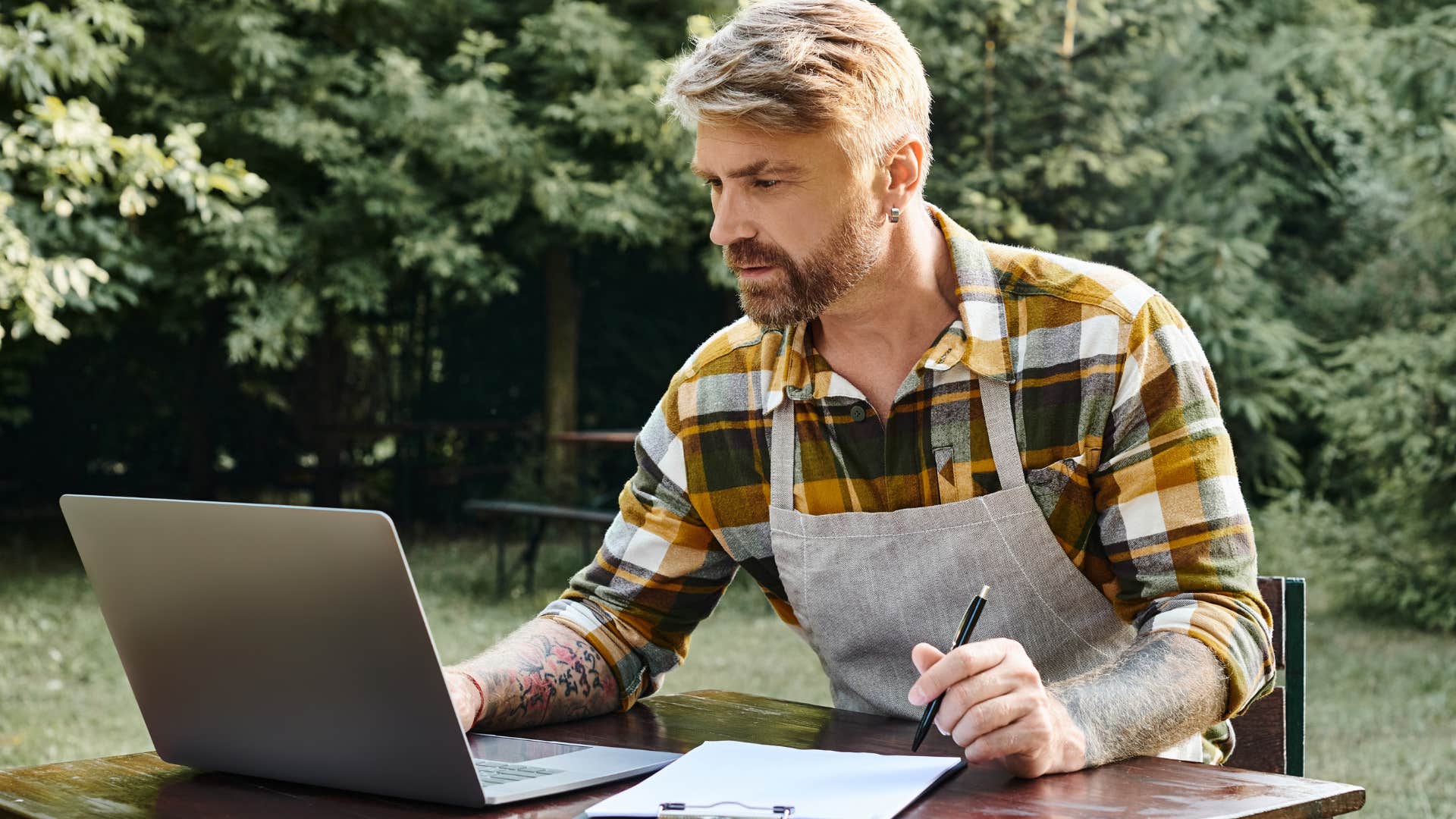 incredibly efficient man working on a laptop outside