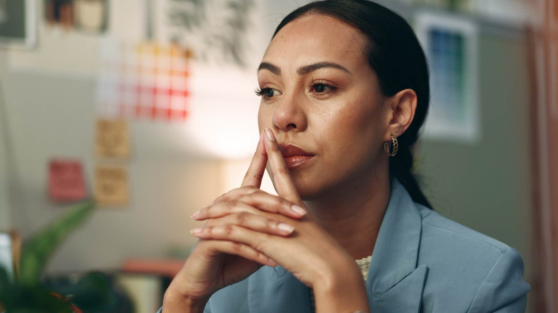 woman who lives mostly in her head thinking at work