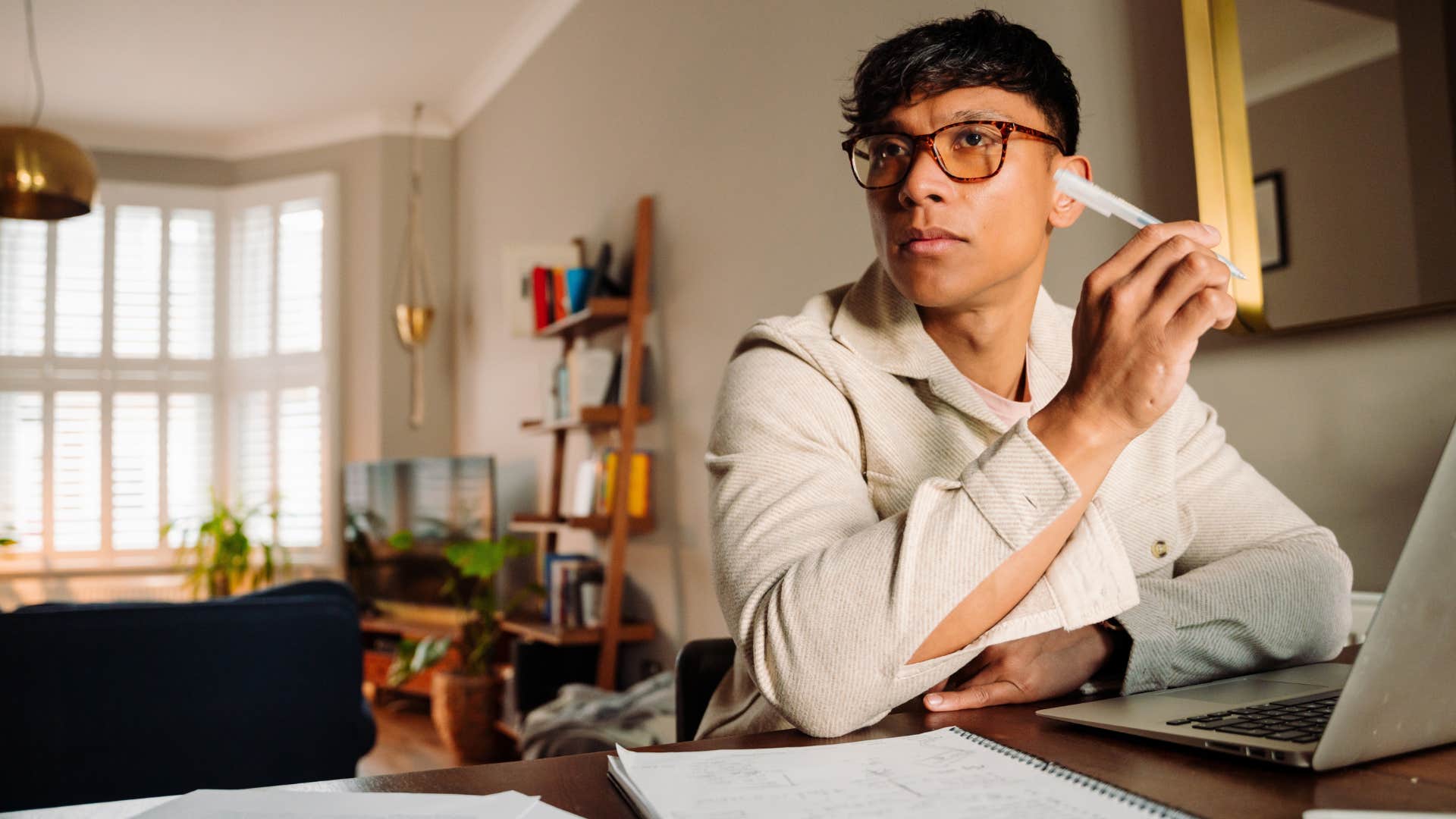 pensive man who needs more space than he's given working hard