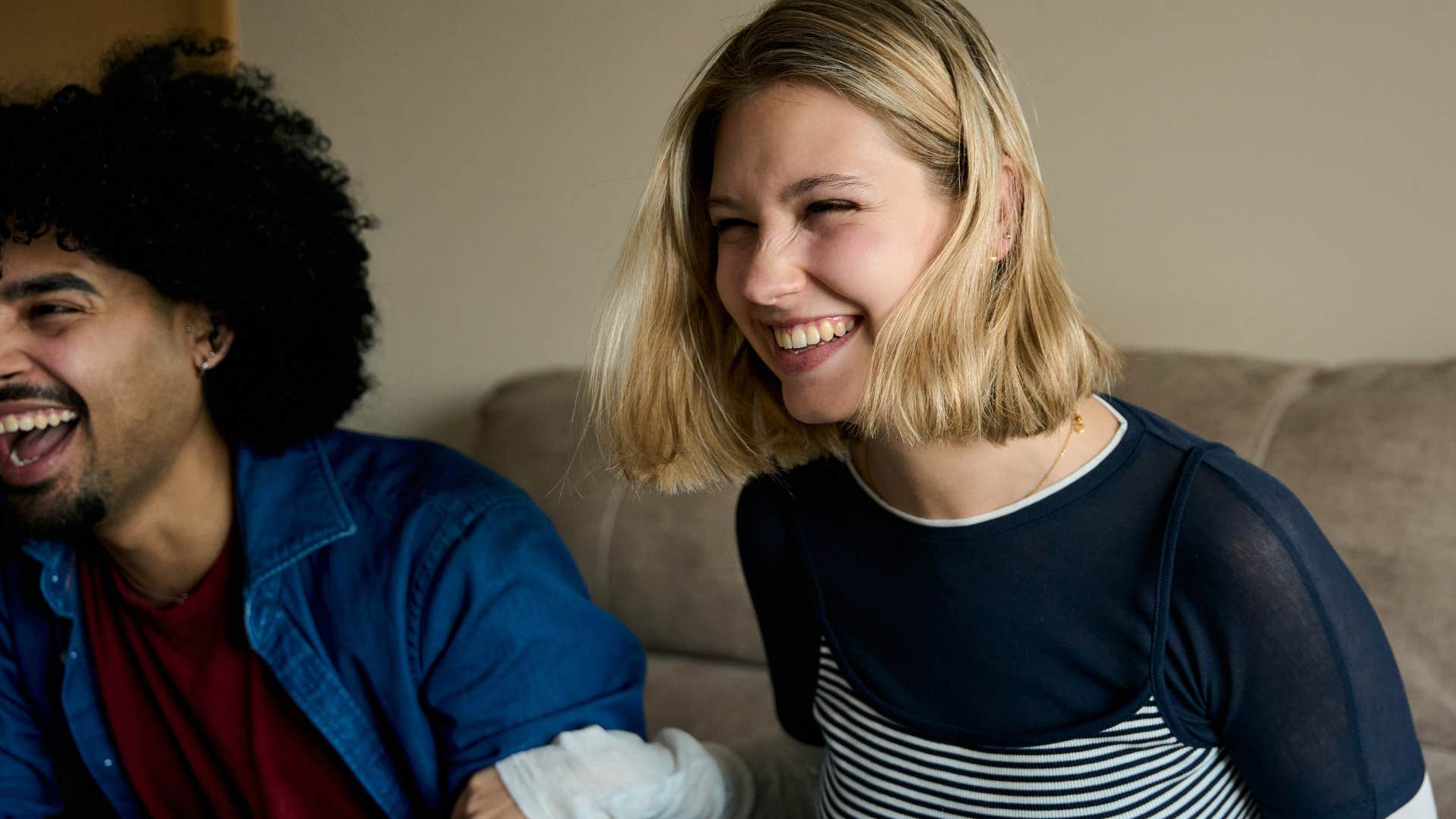 laughing woman seeking out novelty and newness with friends