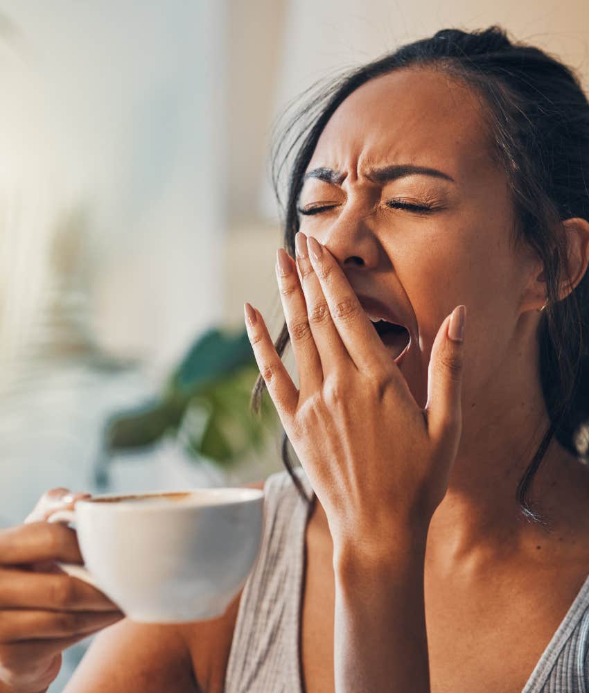 successful person yawns showing not enough sleep