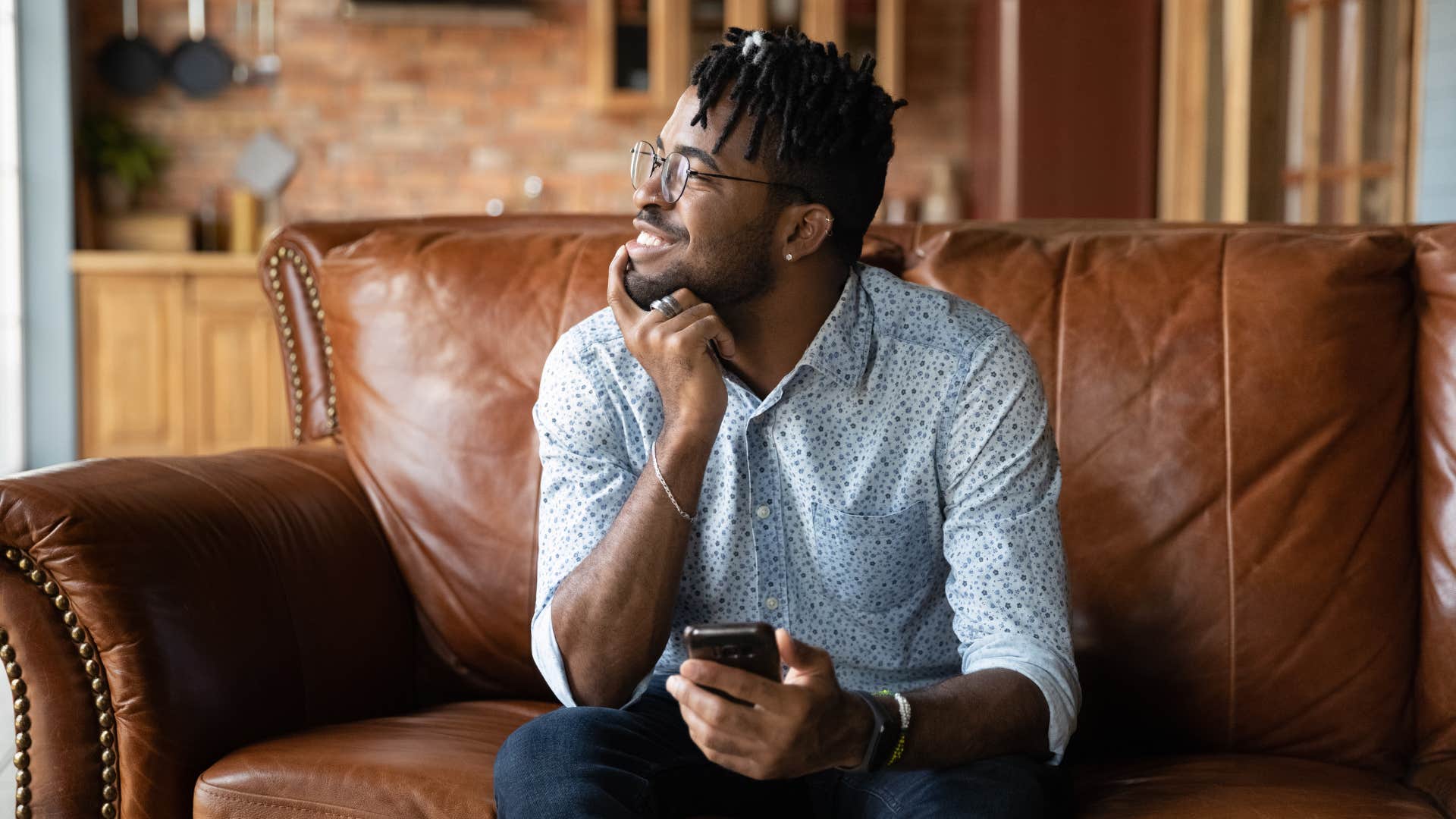 intelligent man speaking to himself positively at home