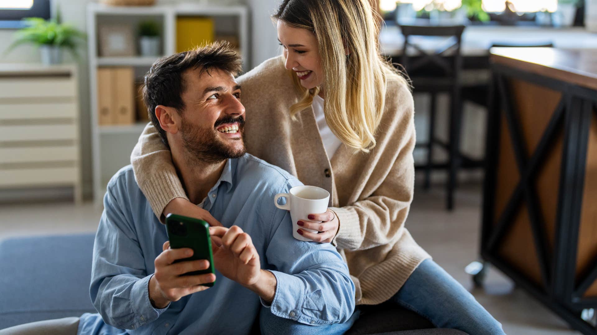 couple sitting on couch together at home