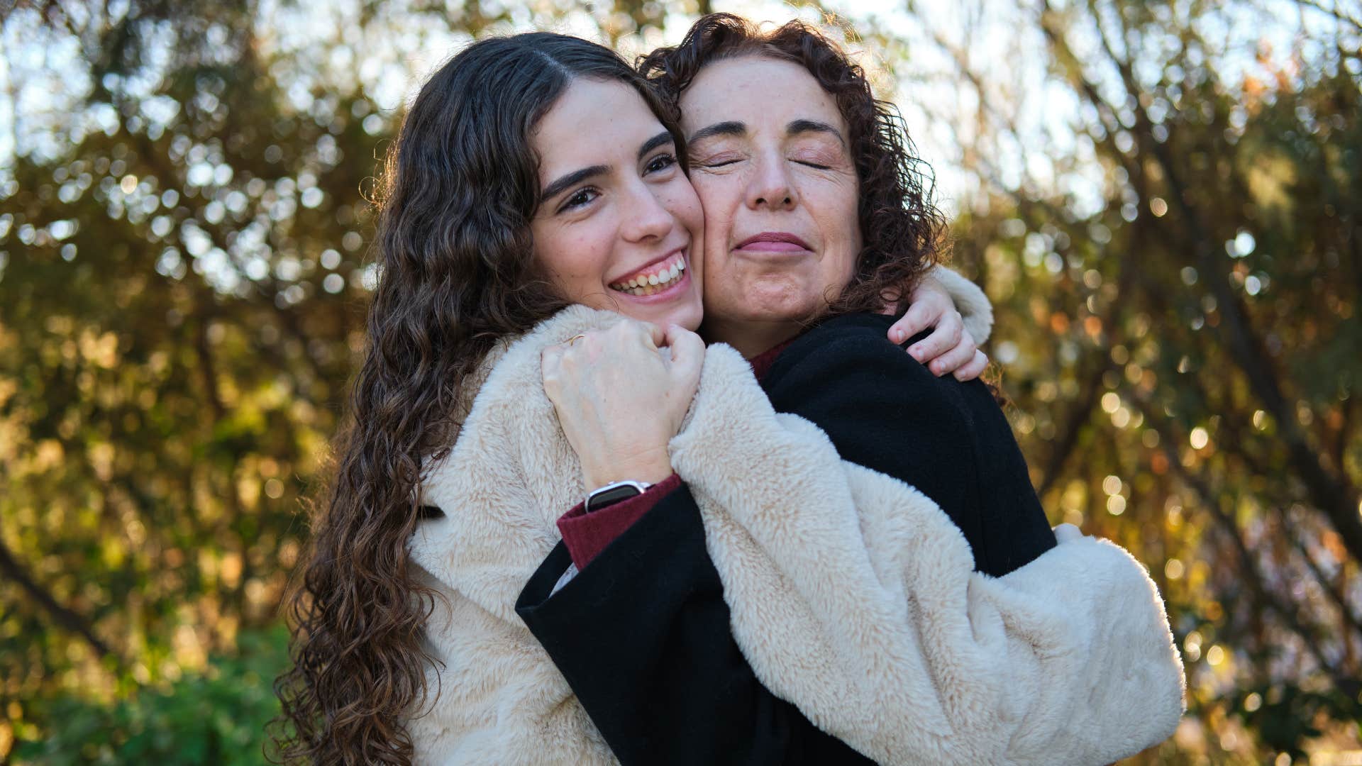 woman hugging mom who says i'm proud of you