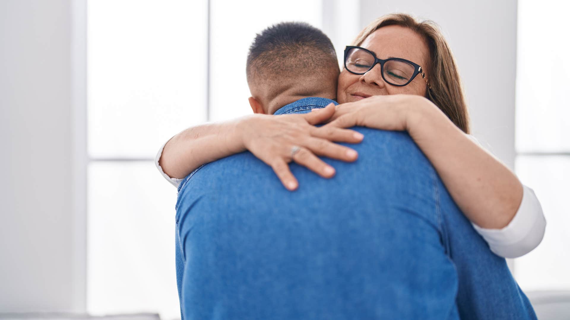 mother hugging son telling him i love who you are