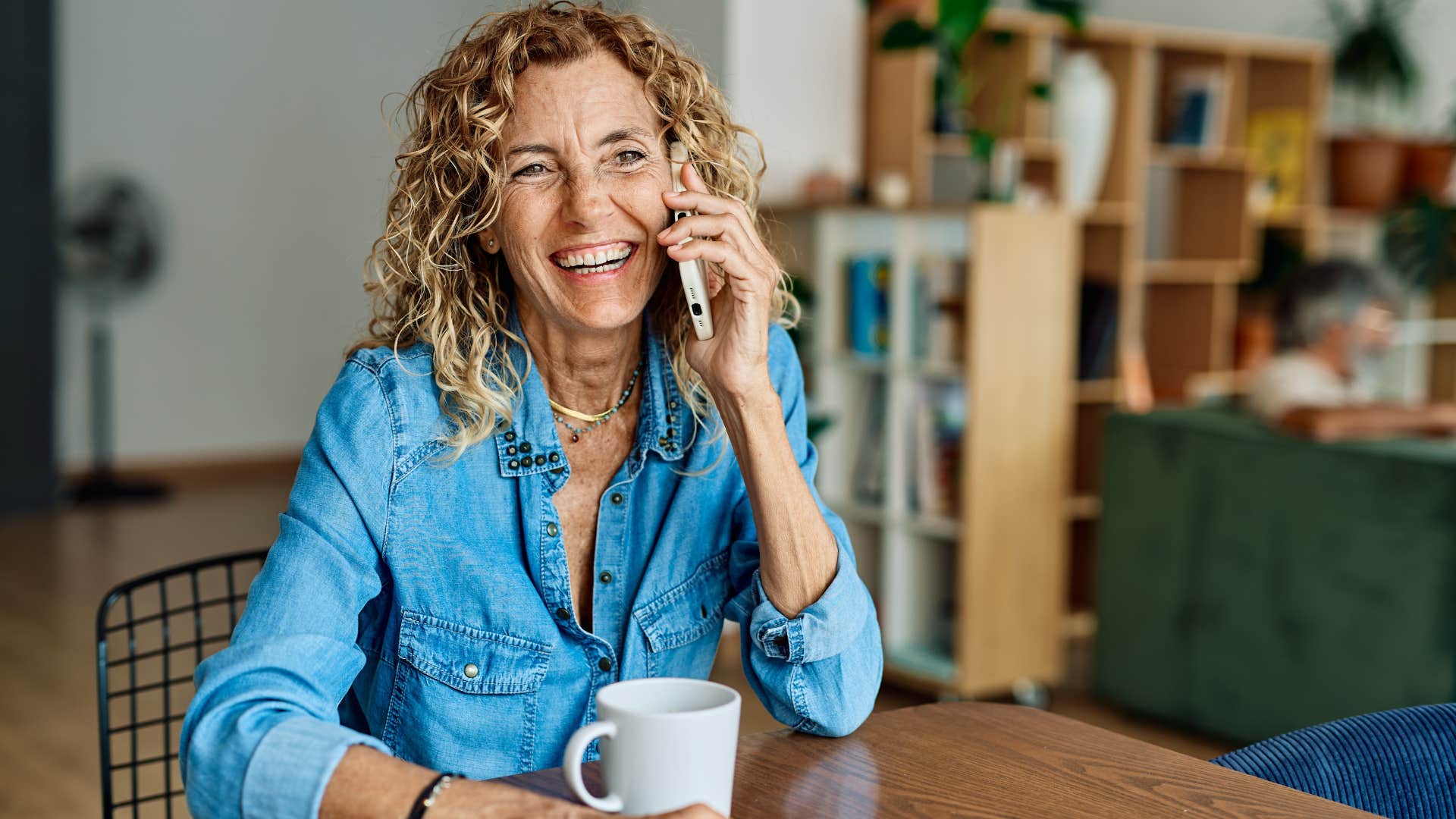 mother happily telling adult kids on the phone we've always got your back