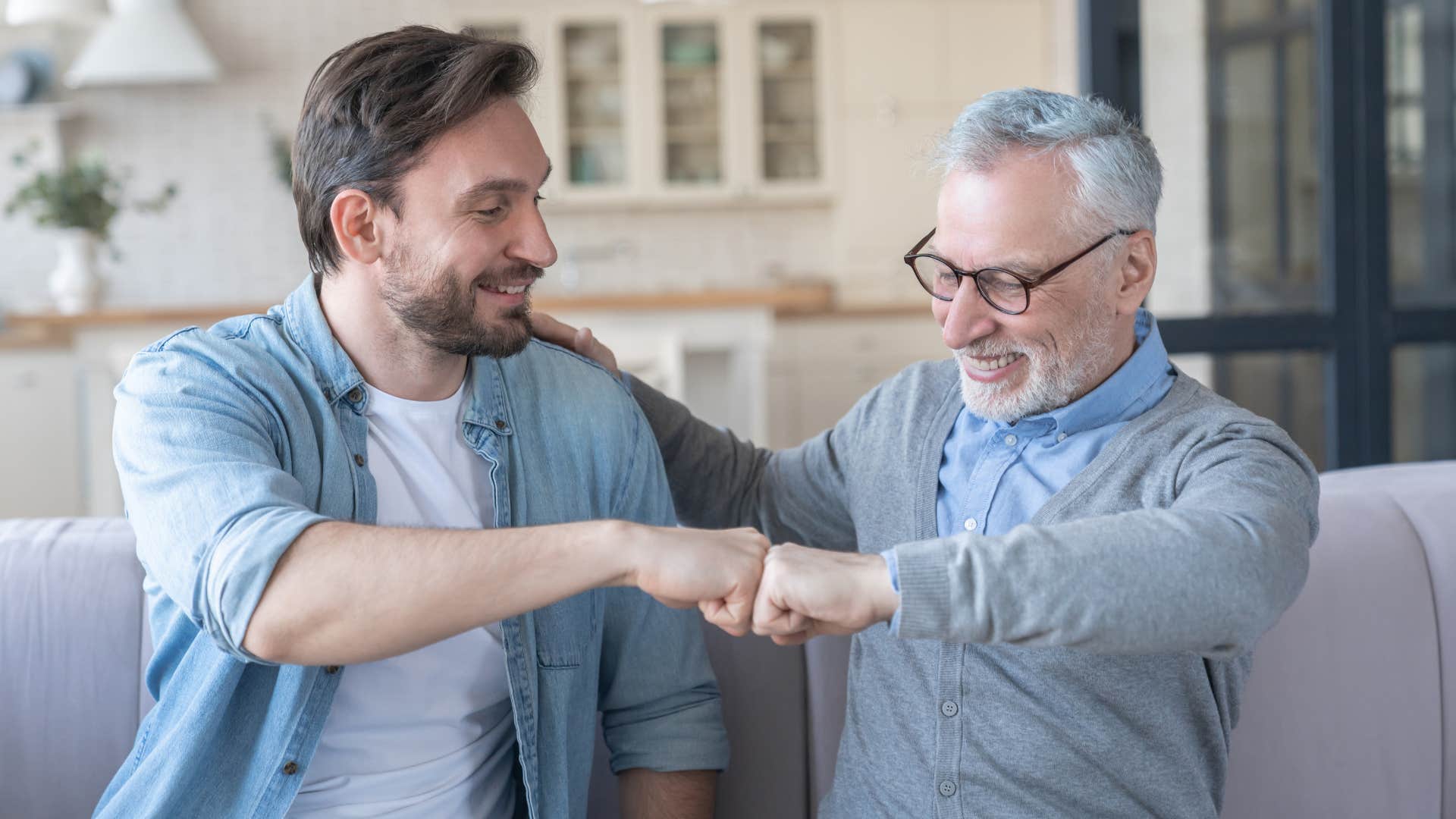 father and son fist-bumping as dad says you've handled this very well
