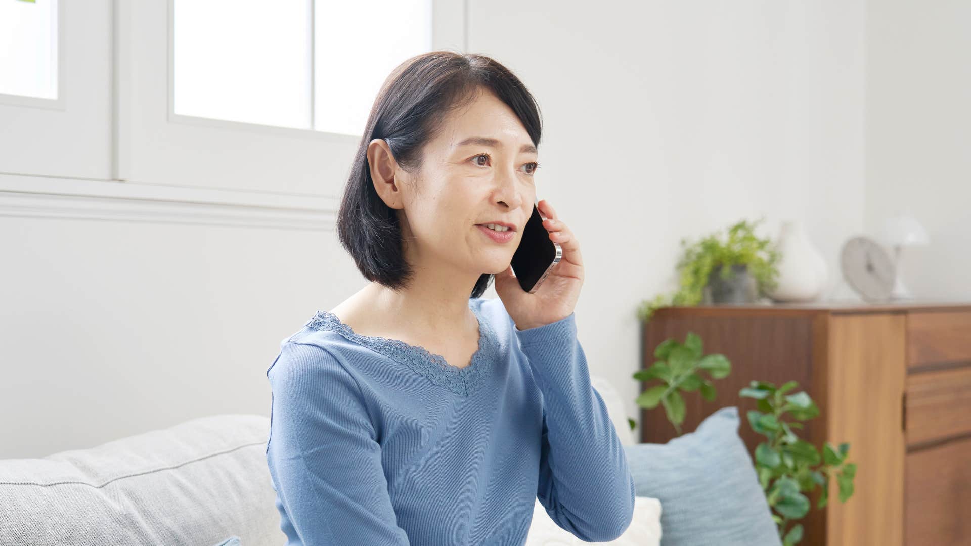 concerned mother on the phone with her grown kids saying you don't owe us an explanation