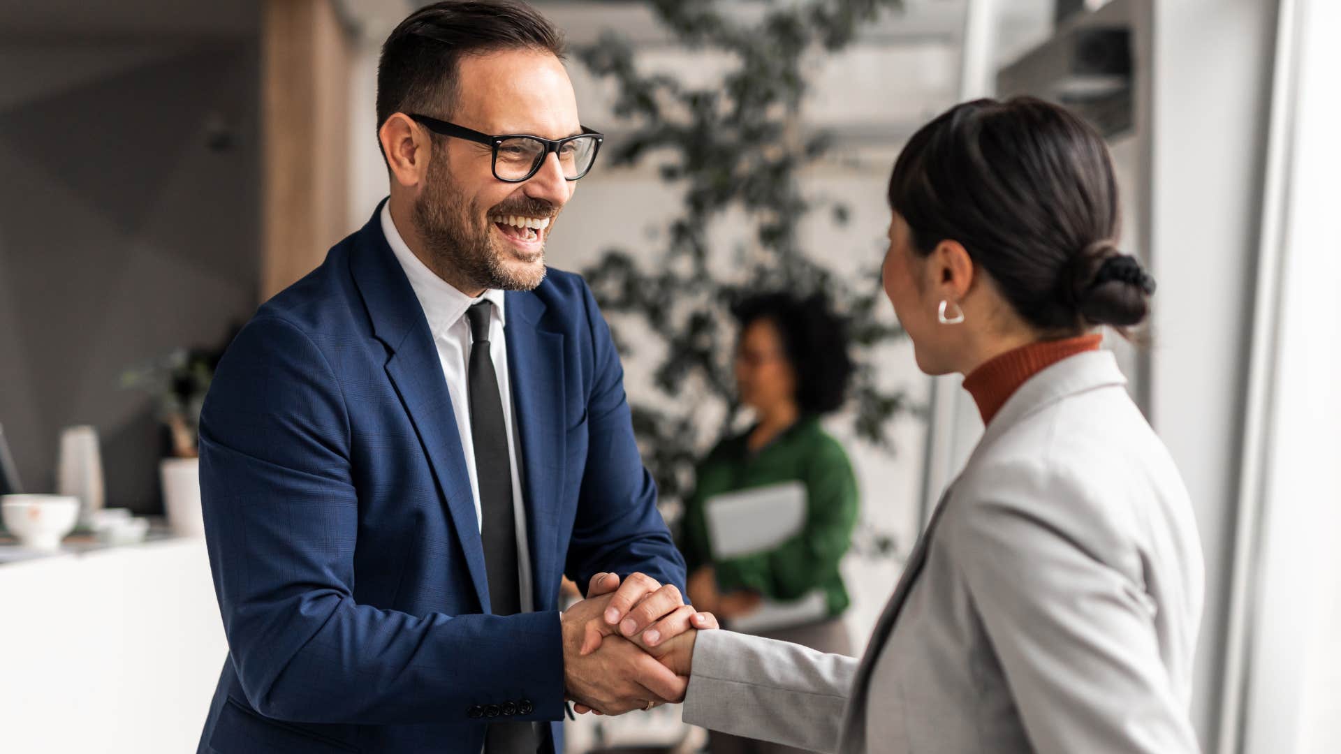 professional man shaking hand saying it was nice to meet you