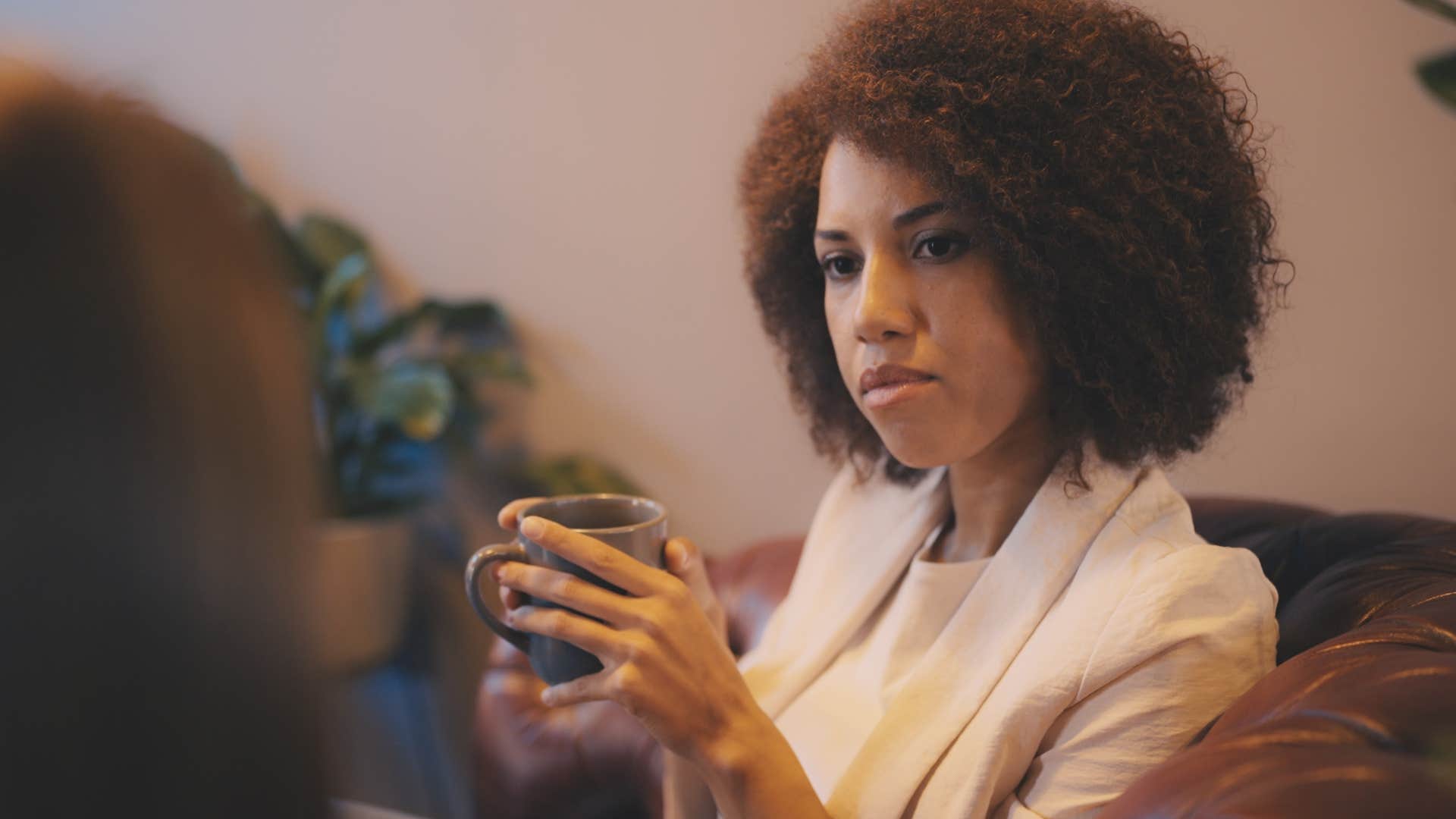 woman saying you're right I'm sorry to her friend in tense conversation