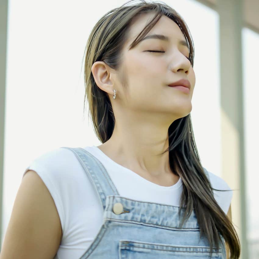 happy woman meditating carving out time for a break