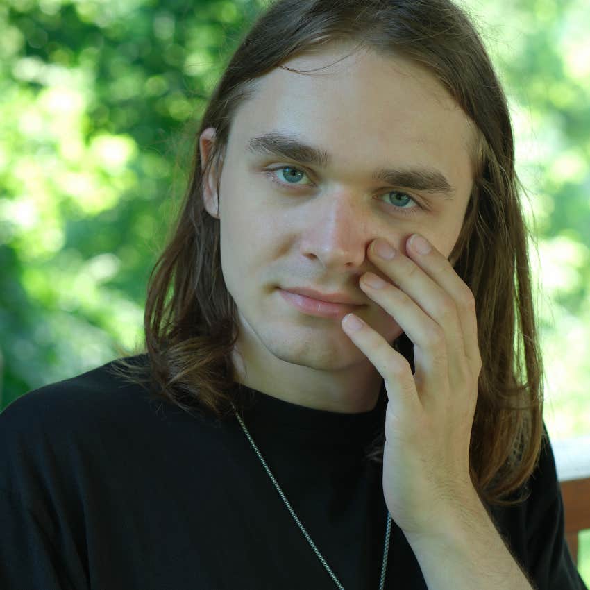 man feeling cobweb face sign of psychic abilities