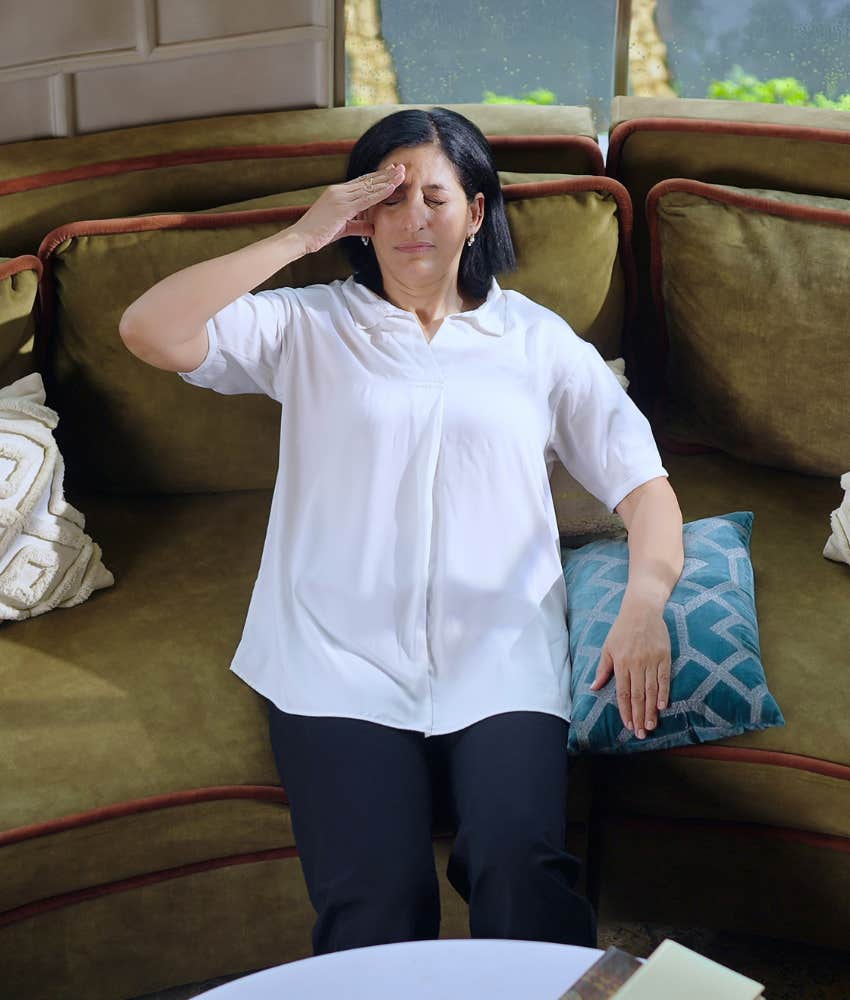 stressed person with headache showing need for management