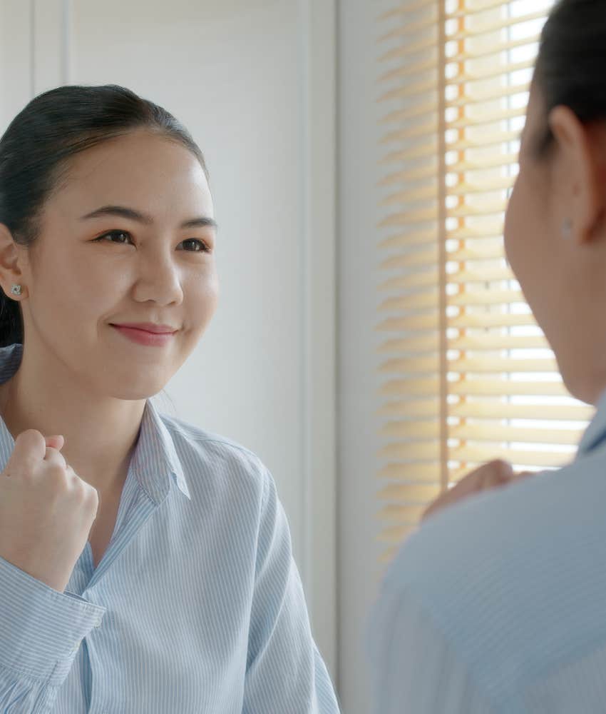 confident person looks in mirror to prepare to not obsess