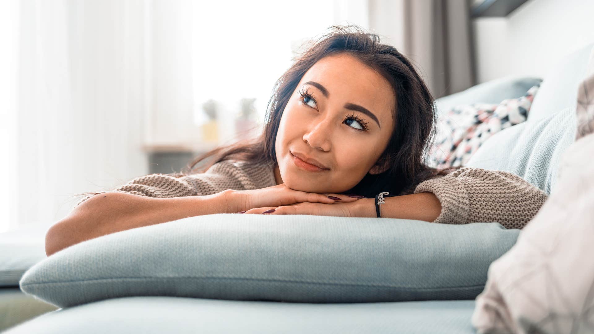 pensive woman intelligently making accurate predictions of the future