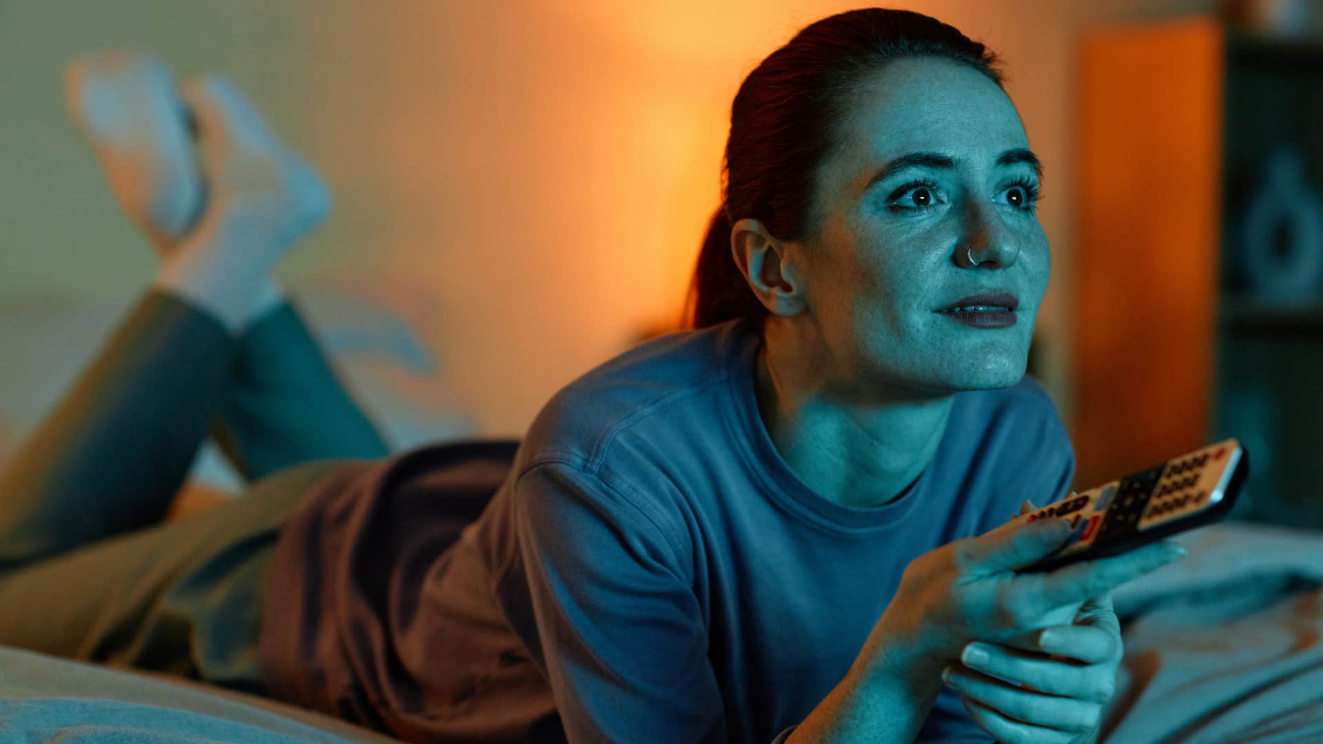 night owl woman staying up late watching television