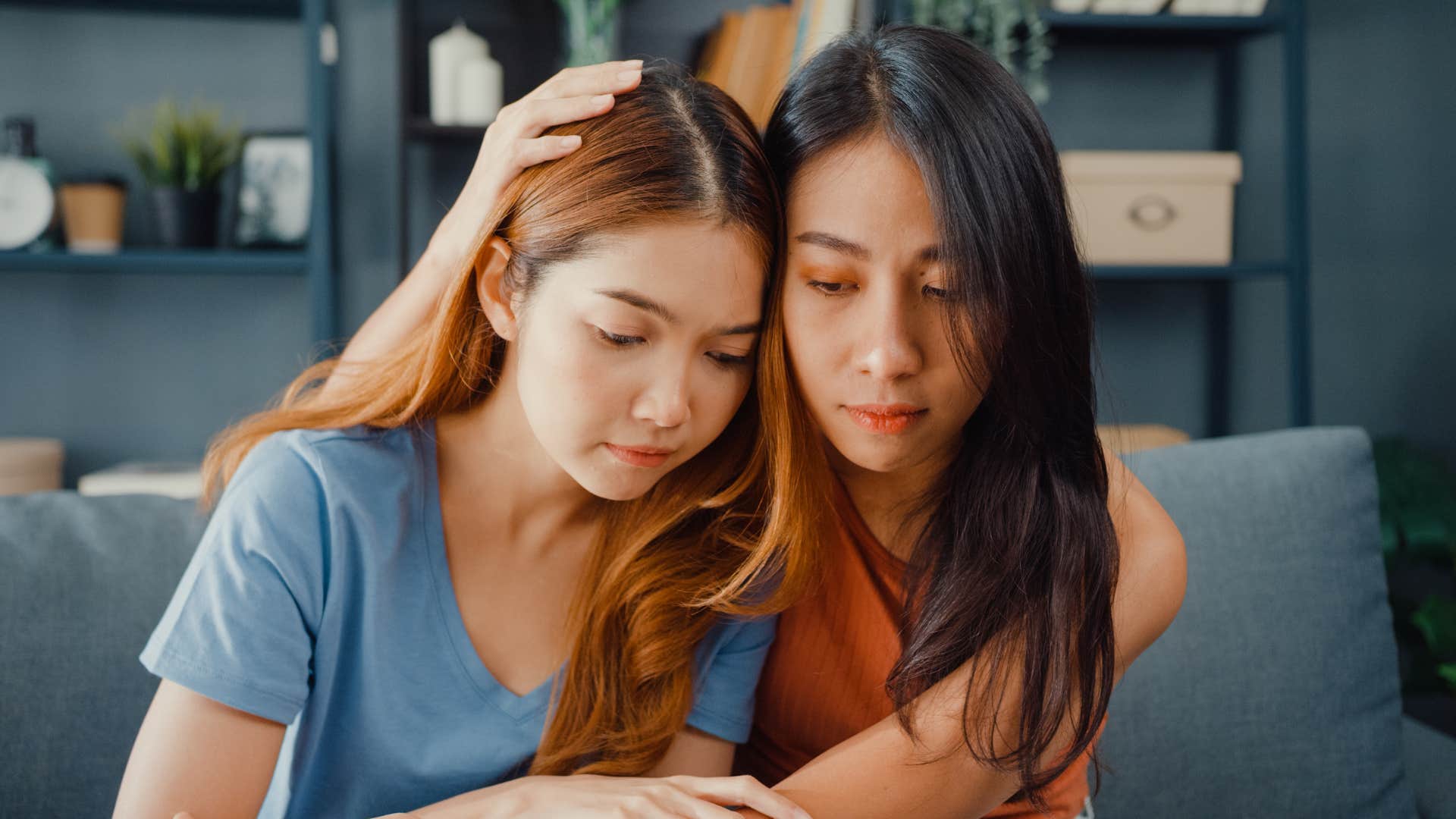 woman raised with a good upbringing comforting friend telling her not a problem