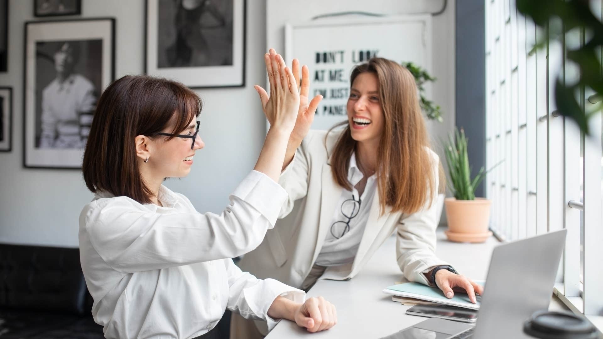 co-workers high-fiving saying we'll work on that