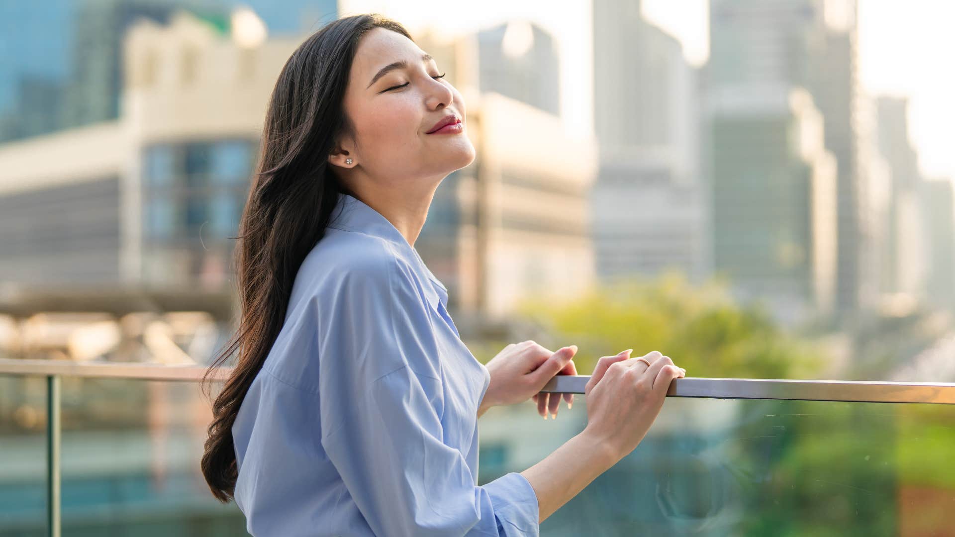 joyful woman feeling relaxed telling herself don't worry about it