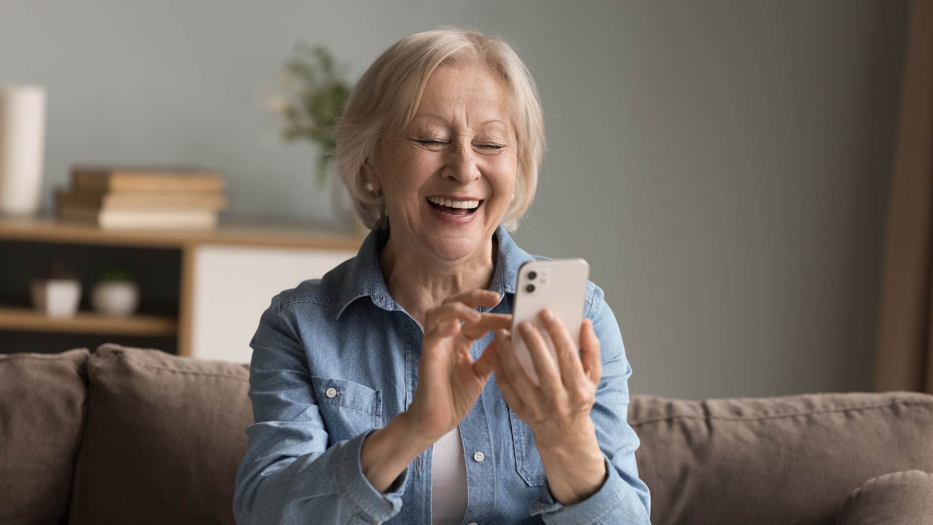 joyful older woman texting i'm excited to see how this turns out to friend