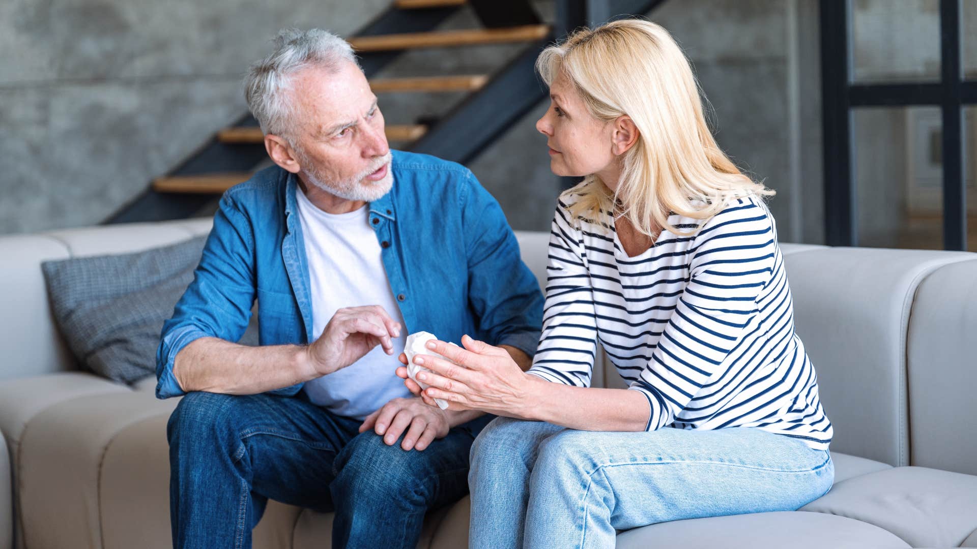 older couple in a discussion admitting i made a mistake