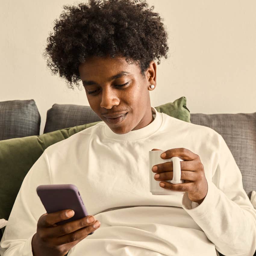 Gen Z man who wants to feel free to be authentic looking at his phone