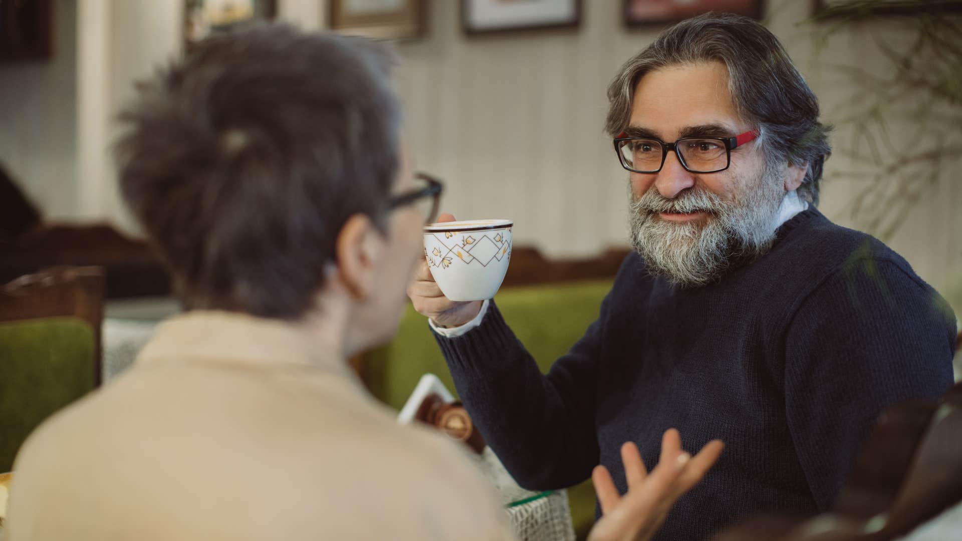 wise older man talking to friend about his experiences