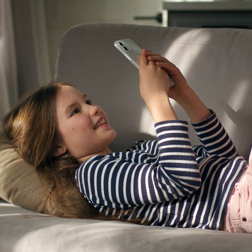 young girl spending too much time on social media on phone